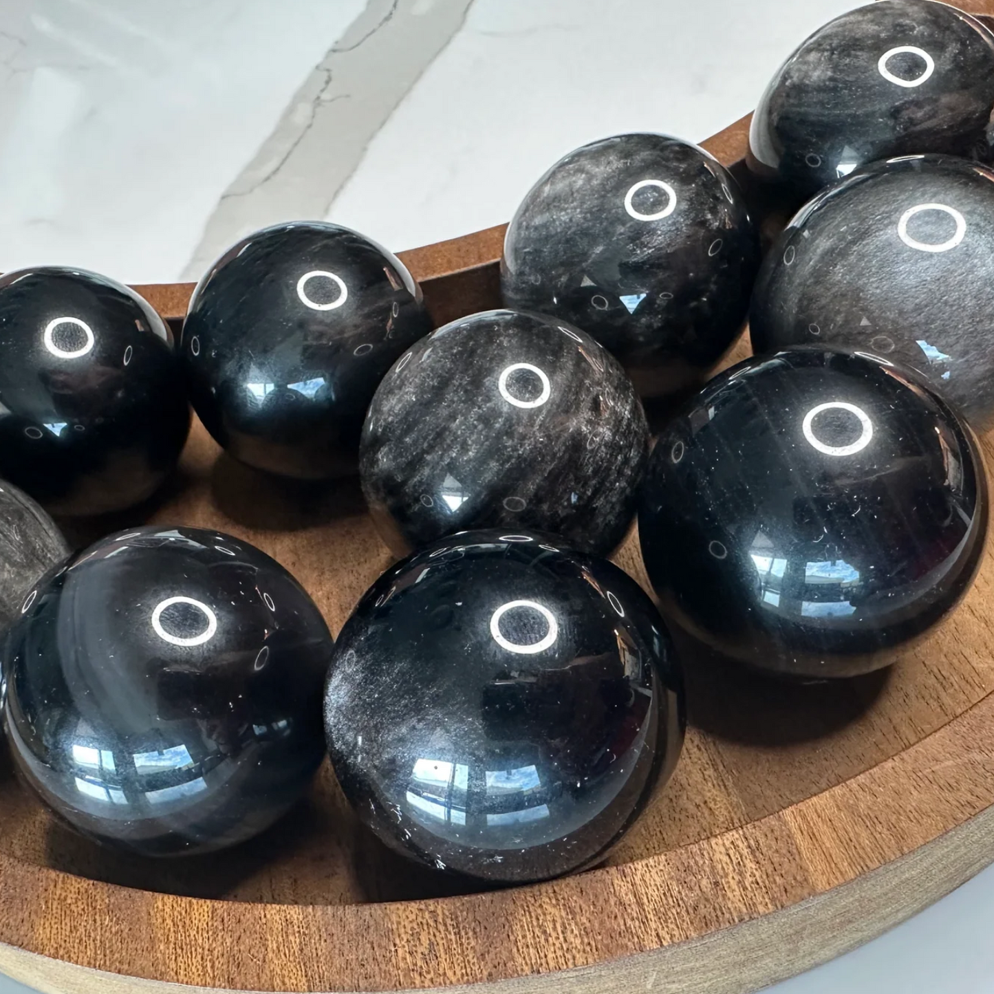 Silver sheen obsidian sphere