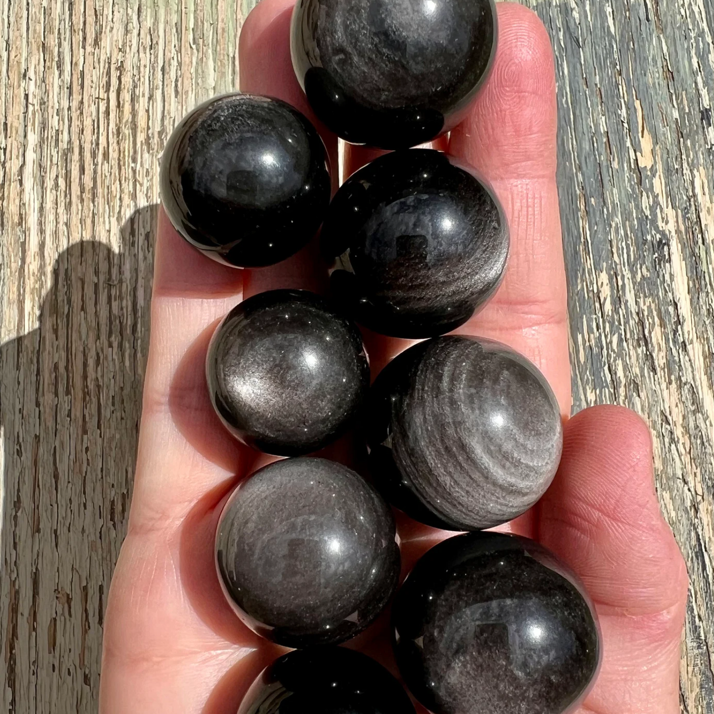 Silver sheen obsidian sphere