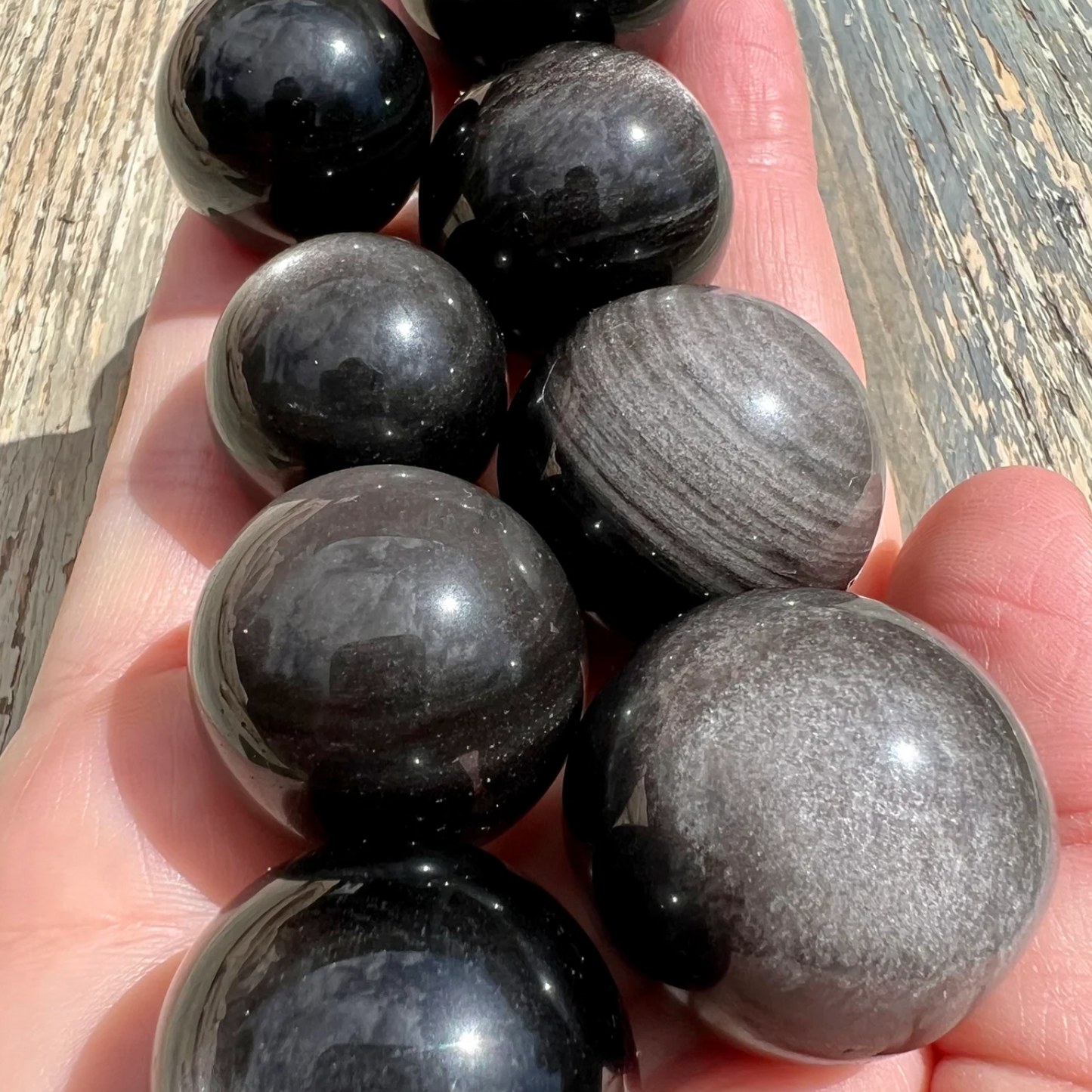 Silver sheen obsidian sphere