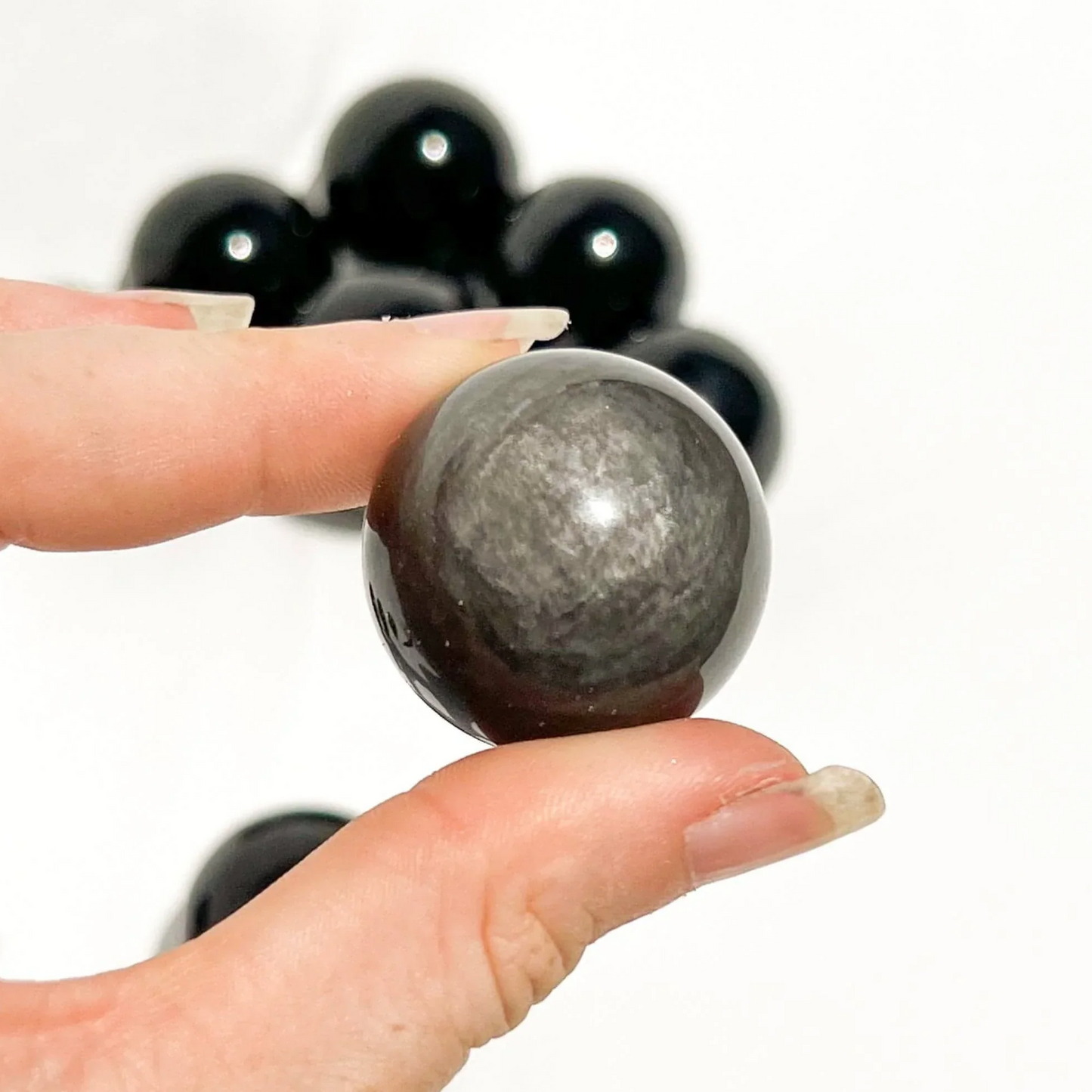 Silver sheen obsidian sphere