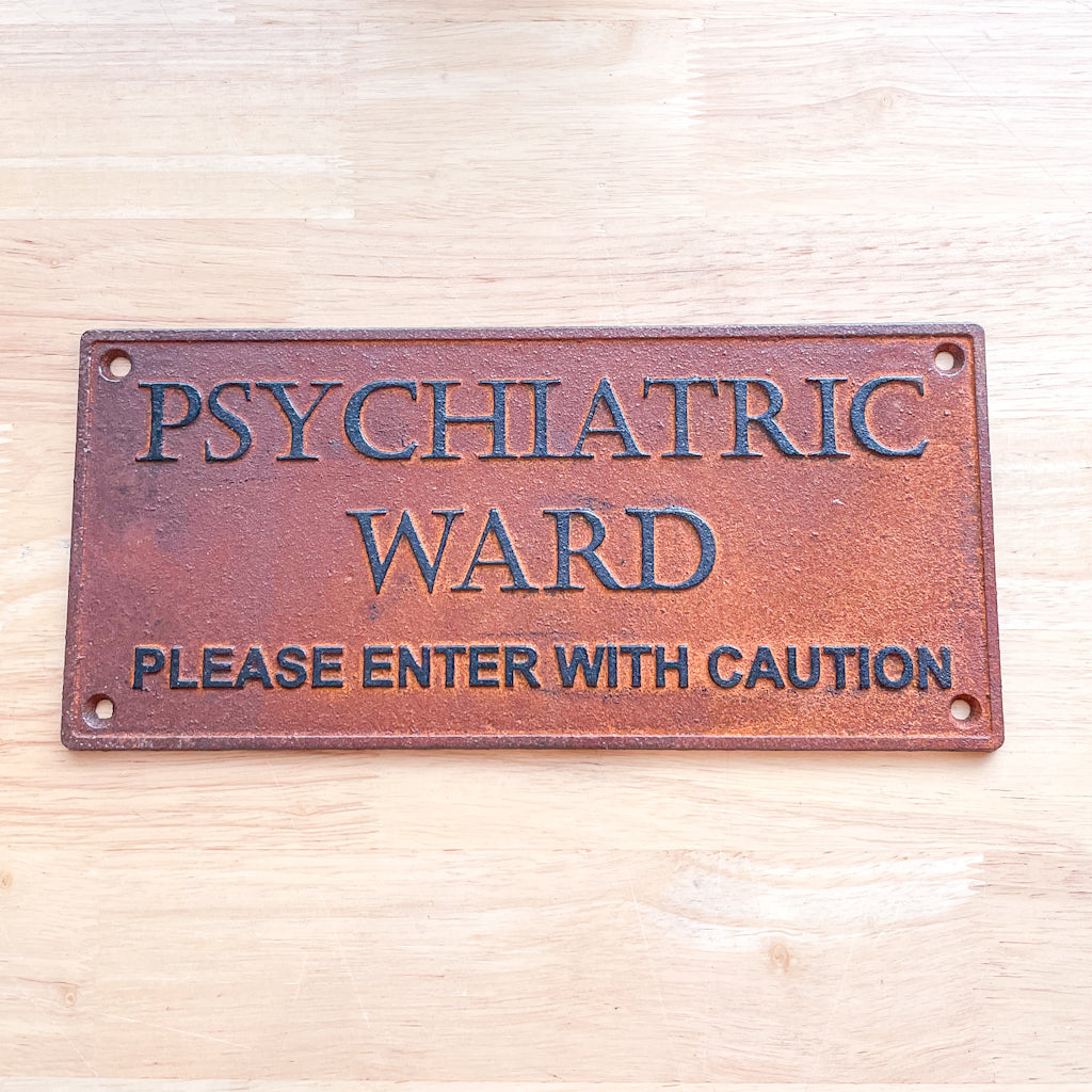 Insane asylum wall hanging rusty metal sign