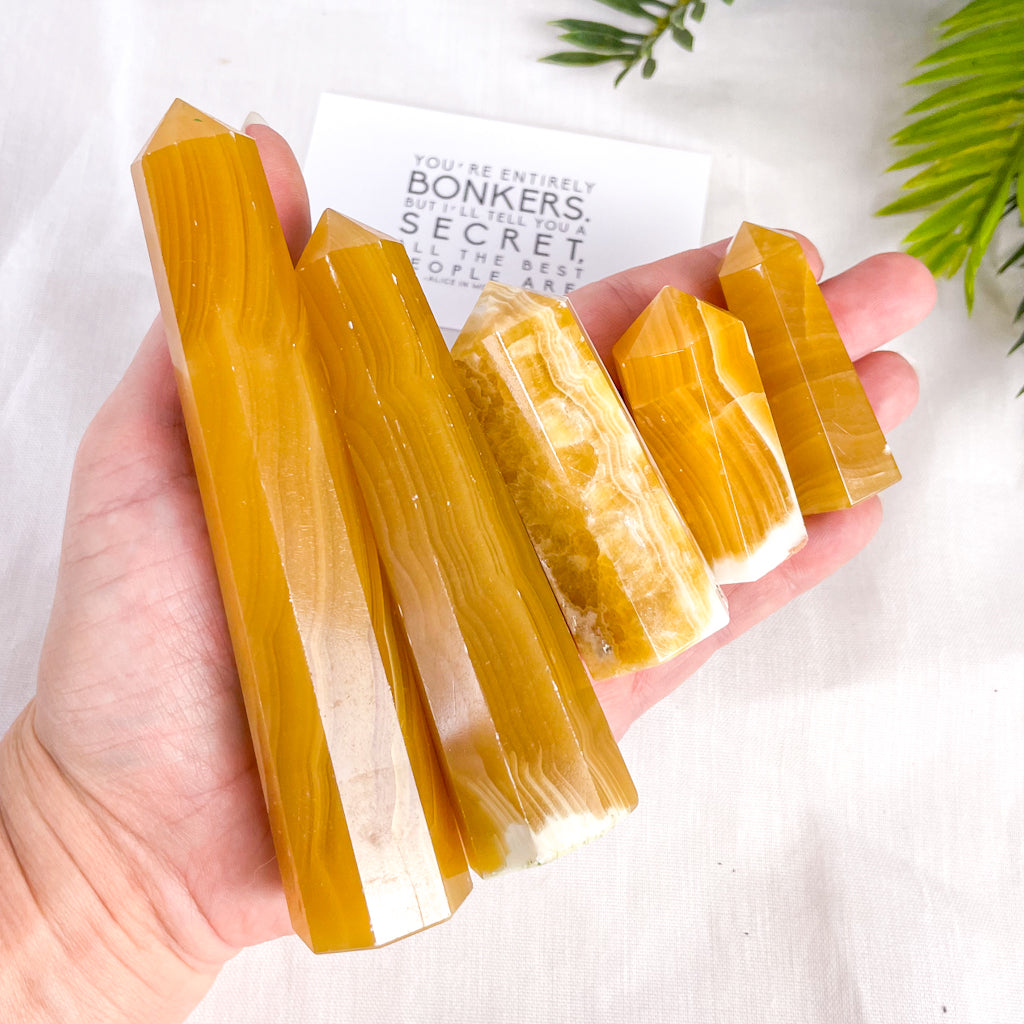 Orange honey calcite crystal tower