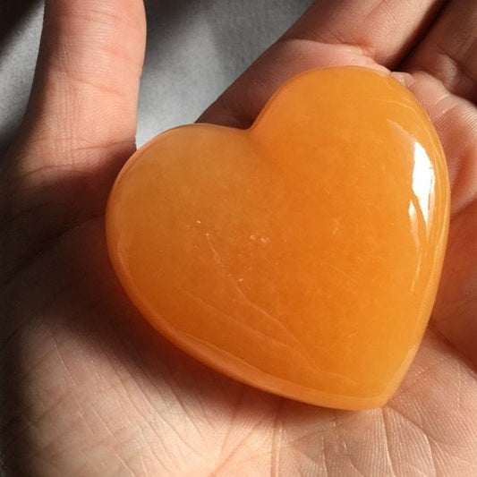 Orange calcite crystal heart large