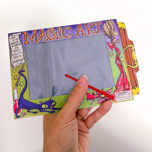 Novelty magic disappearing art board