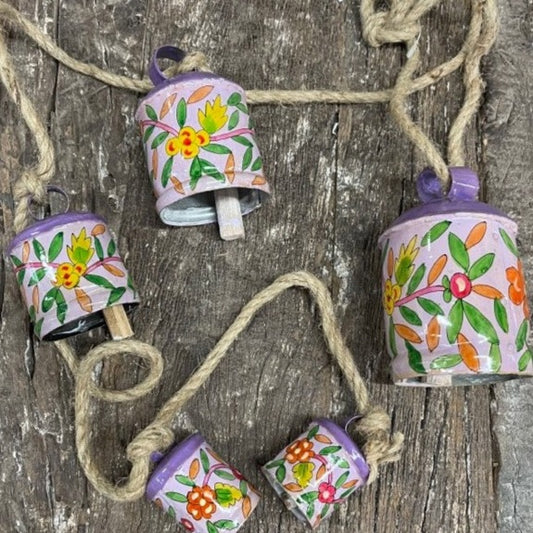 Vintage brass cow bell set 5 on rope floral purple