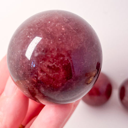 Strawberry quartz crystal sphere