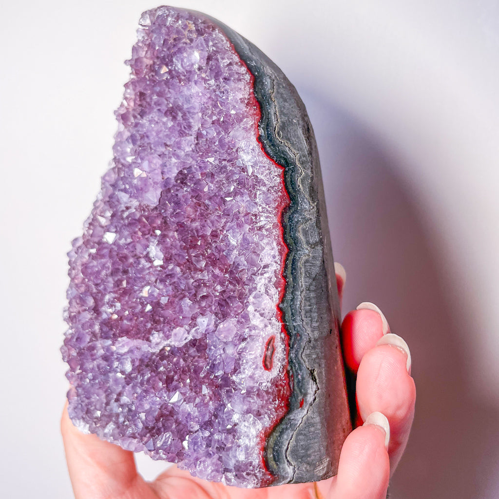 Polished edge amethyst crystal cluster cut base
