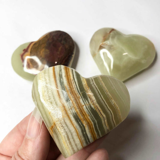 Banded green onyx crystal polished heart shaped palm stone