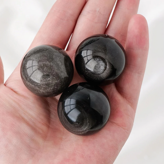 Silver sheen obsidian sphere