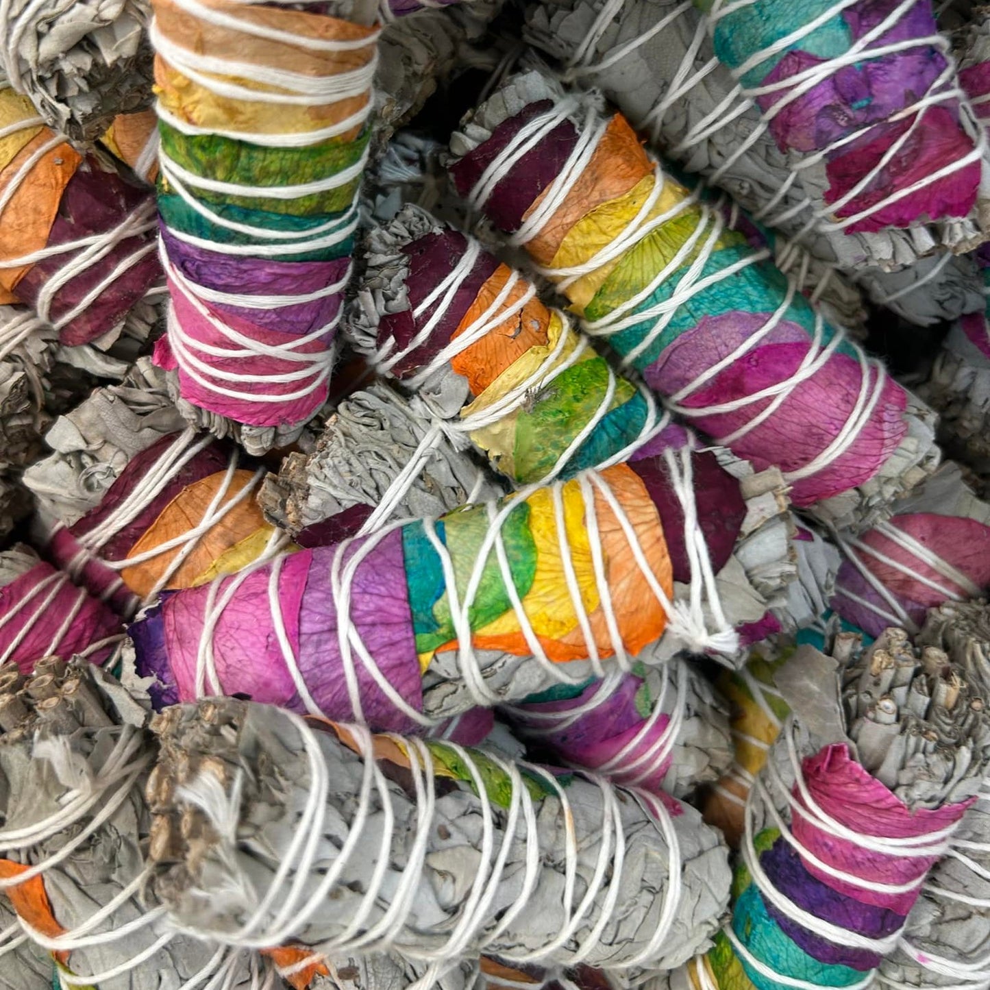 Sage incense smudge stick bundle with chakra flowers