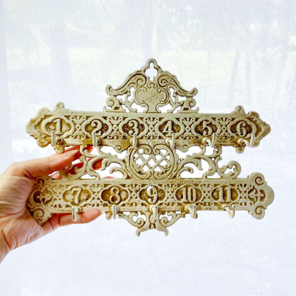 Cast iron ornate hotel key numbers vintage wall hooks painted ivory