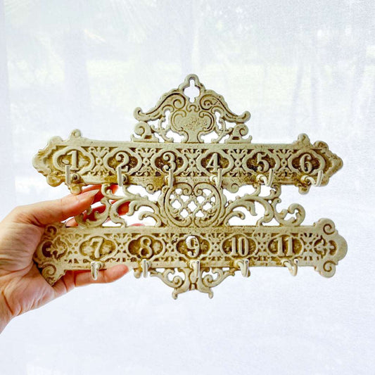 Cast iron ornate hotel key numbers vintage wall hooks painted ivory