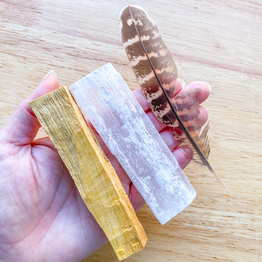Palo santo wood incense smudge stick, crystal and feather bundle