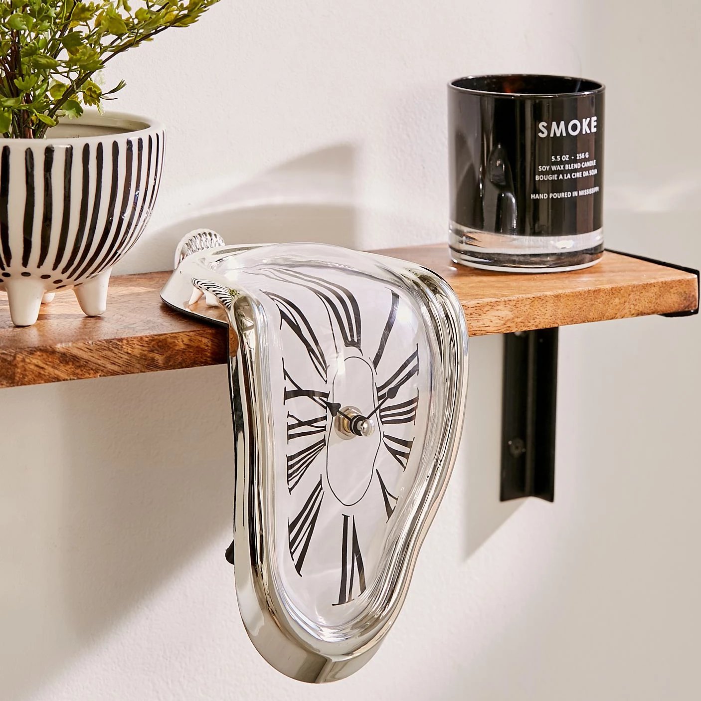 Dali / Alice in wonderland melting clock statue