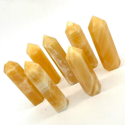 Orange honey calcite crystal tower
