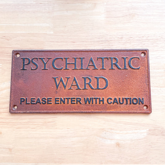 Insane asylum wall hanging rusty metal sign