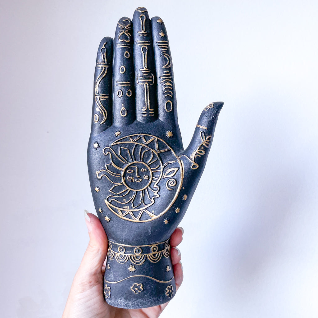 Sun moon zodiac palm hand statue