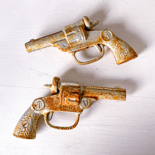 Vintage cast iron pistol / cap gun statue