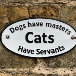 Dogs have masters, Cats have servants naughty cast iron sign