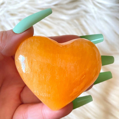 Orange calcite crystal heart large