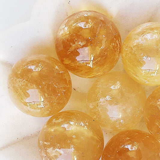 Honey calcite polished sphere crystal ball