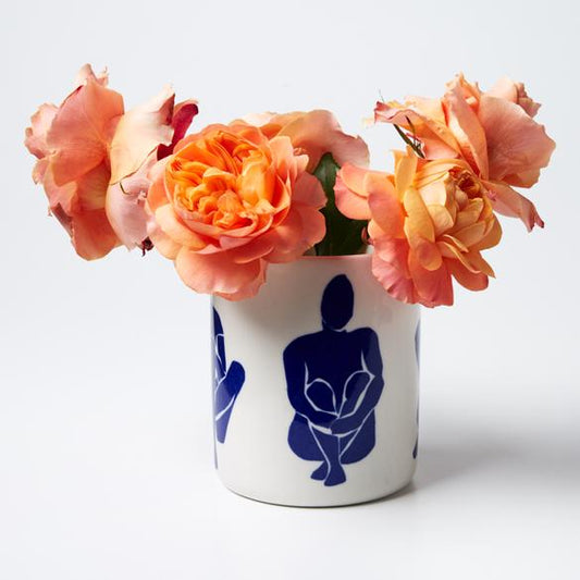 Navy & white sitting around planter pot